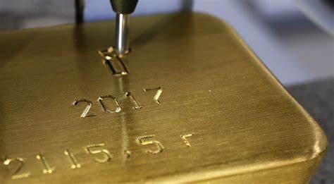 Gold hovers near two-week high on dollar weakness, US fiscal woes