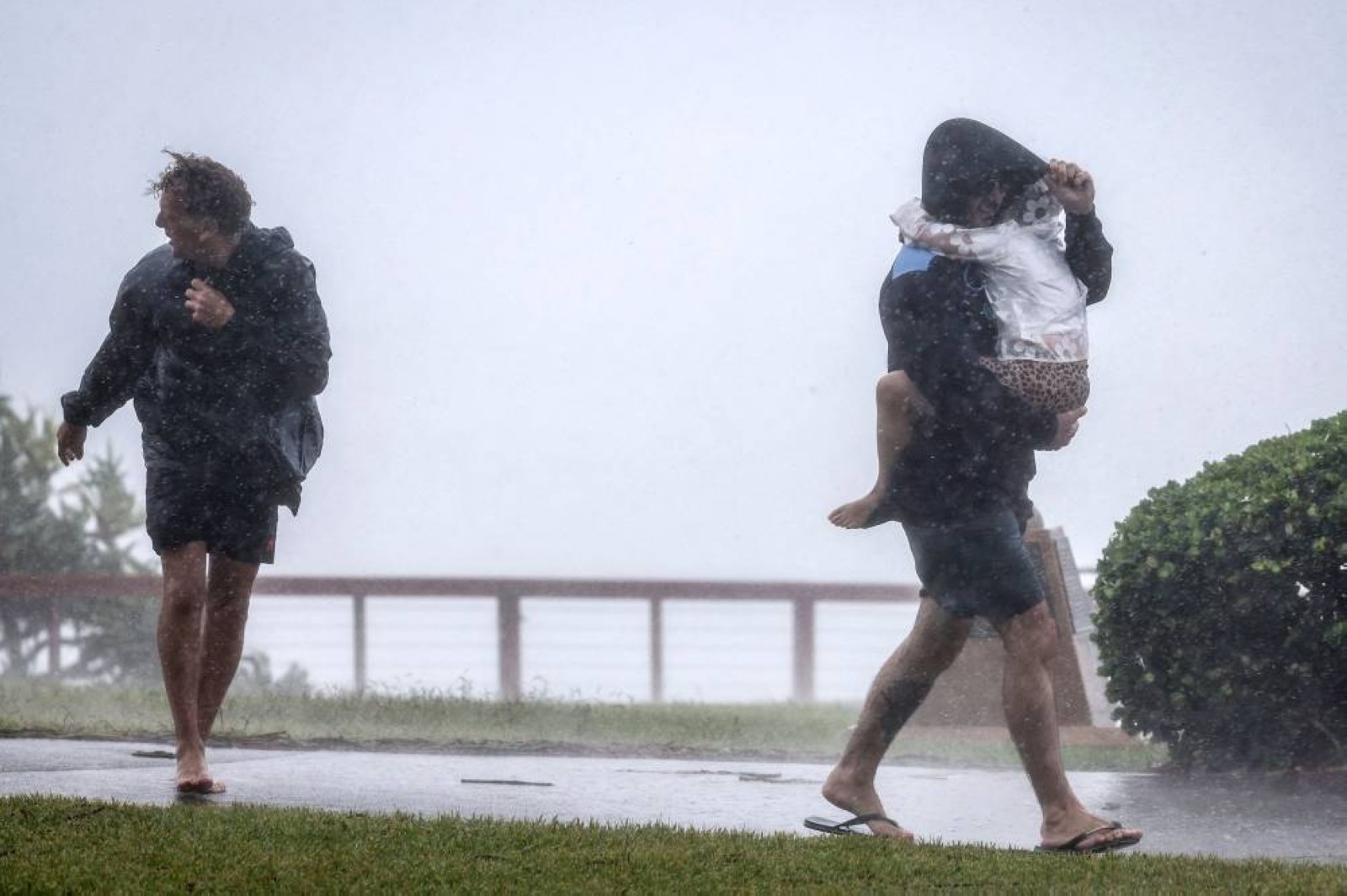 Australian homes lose power and people evacuate as tropical cyclone approaches; 1 man missing