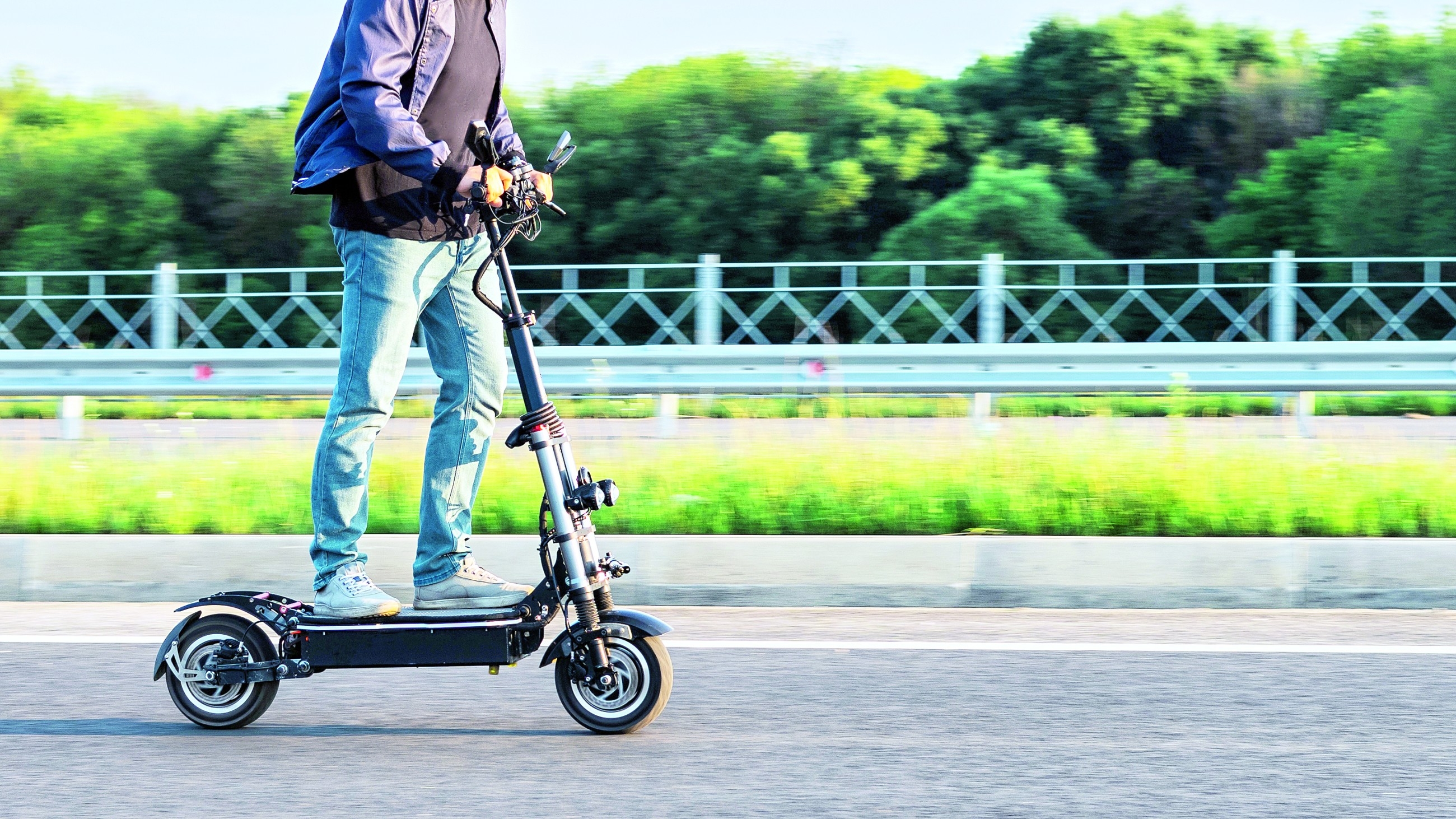 Father fined after son riding electric bike jumps red light and collides with woman's car