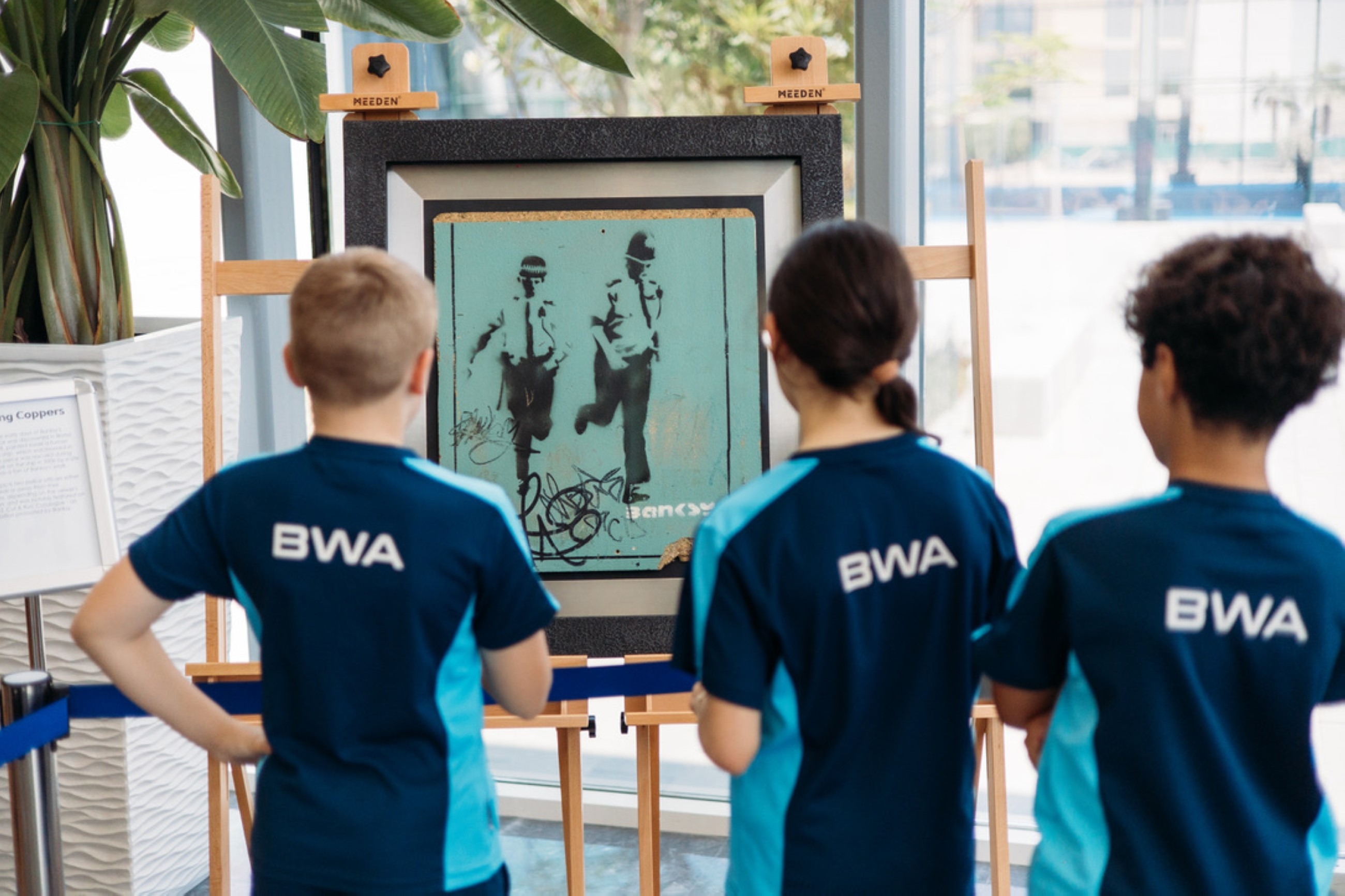 Bloom World Academy banks on Banksy's bouquets for baccalaureates