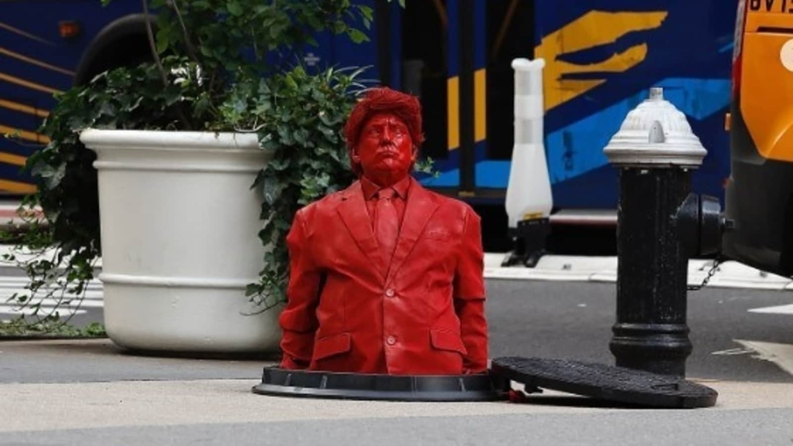 Trump's bright red sculpture emerges from NYC manhole, White House reacts as netizens hail James Colomina's creation