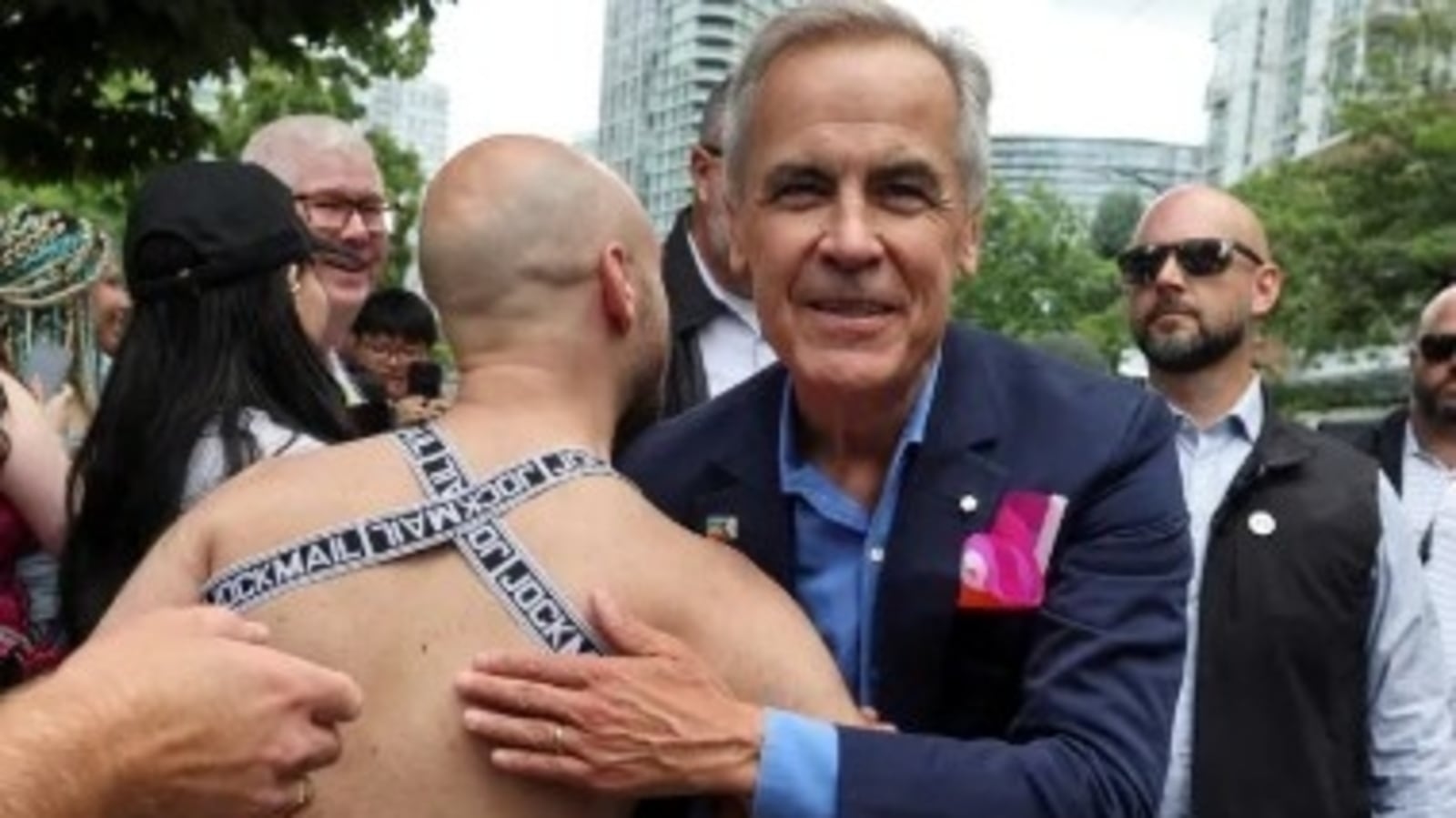 Canadian PM Mark Carney draws mockery over viral photo with nearly naked man at Vancouver Pride: ‘This is why Trump…'