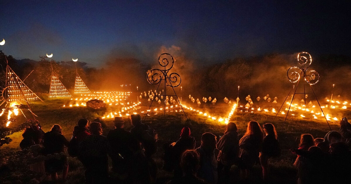 Spectators gather for ancient Celtic fire procession that welcomes summer