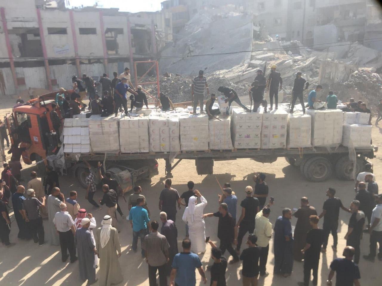 Palestinian families secure trucks, humanitarian warehouses, enabling first aid distribution to households in months