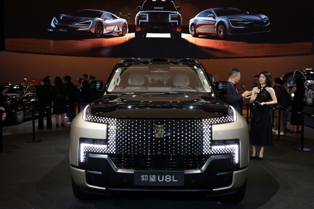 Trade war tremors and tech crackdown jolt Shanghai auto show