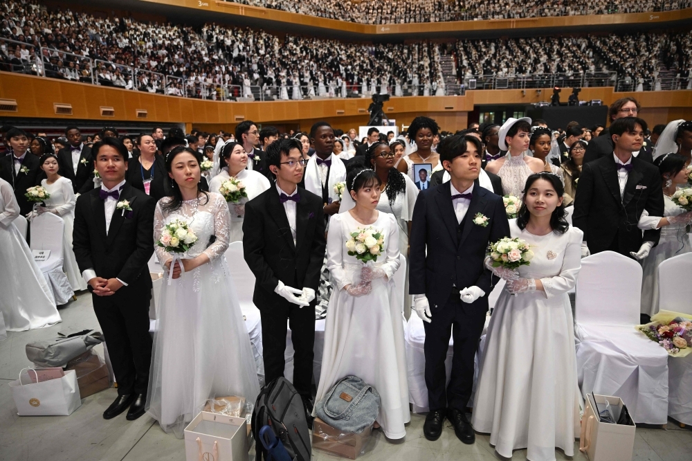 Mass wedding, messier truths: Moonies say ‘I do' amid cult claims and Japan crackdown