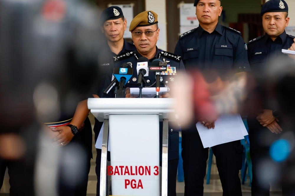 Perak cops bust illegal lottery ring in Ipoh, seize RM110,000 in cash and arrest four suspects