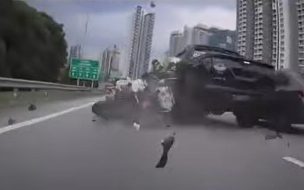 Driver detained after 4WD hits couple on high-powered motorcycle near Duta toll, seen fleeing in viral video