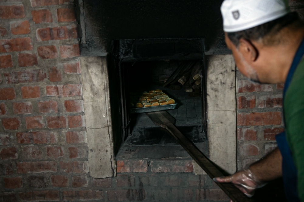 A century-old oven, a family legacy: The irresistible charm of Kilang Roti Mokhtar's firewood-baked buns