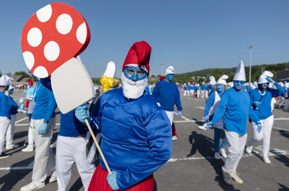 Smurf and proud: French town paints itself blue to smash world record