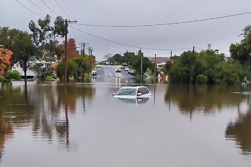 Australia floods: Death toll rises to four, tens of thousands remain stranded