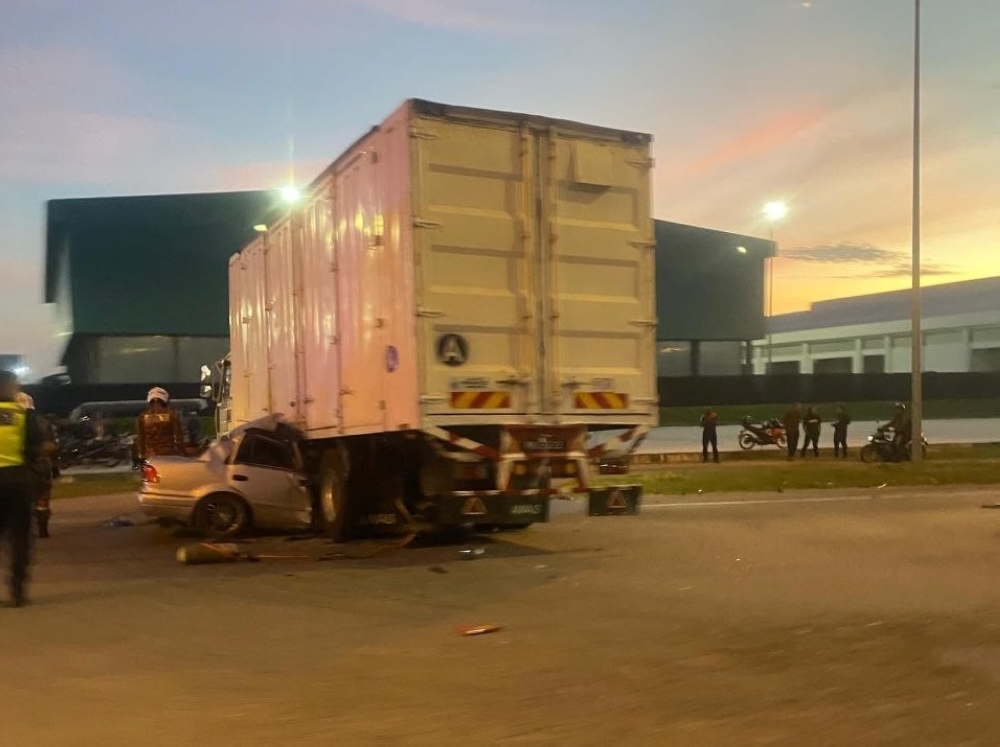 Dawn crash in Melaka leaves two dead in Toyota crushed beneath lorry