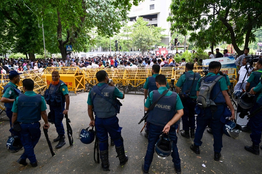 Bangladesh's Yunus in crisis talks with rival parties as Dhaka protests escalate over election timing