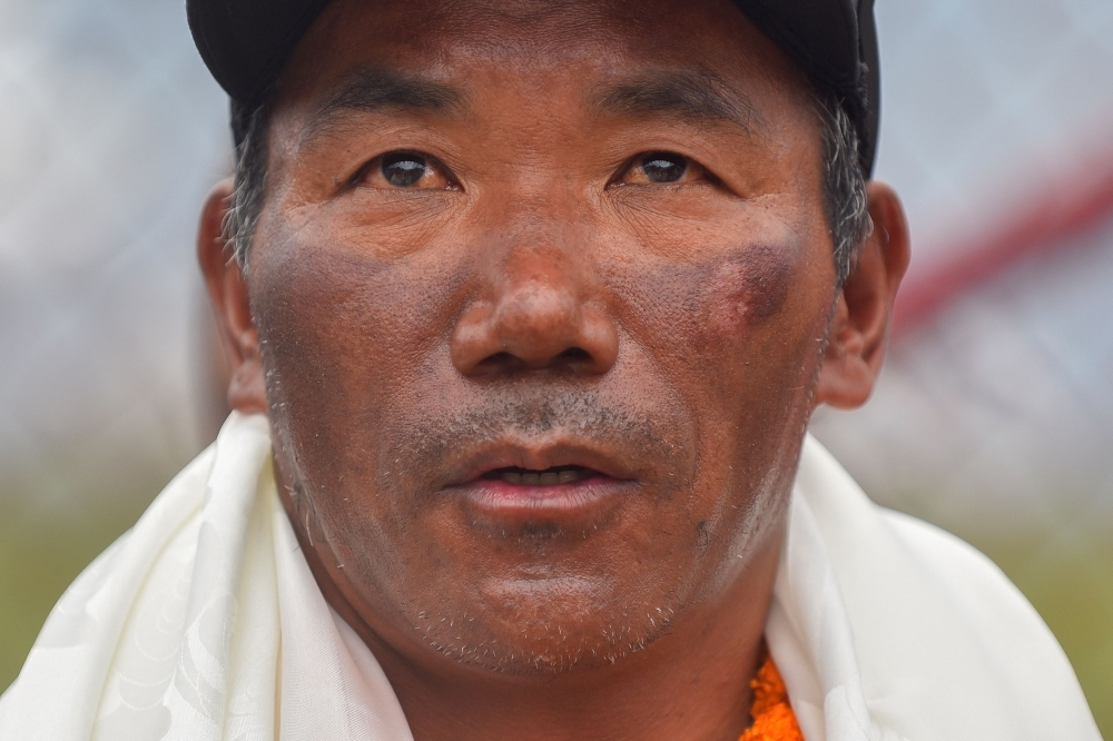 Nepali ‘Everest Man' reaches new heights with historic 31st summit