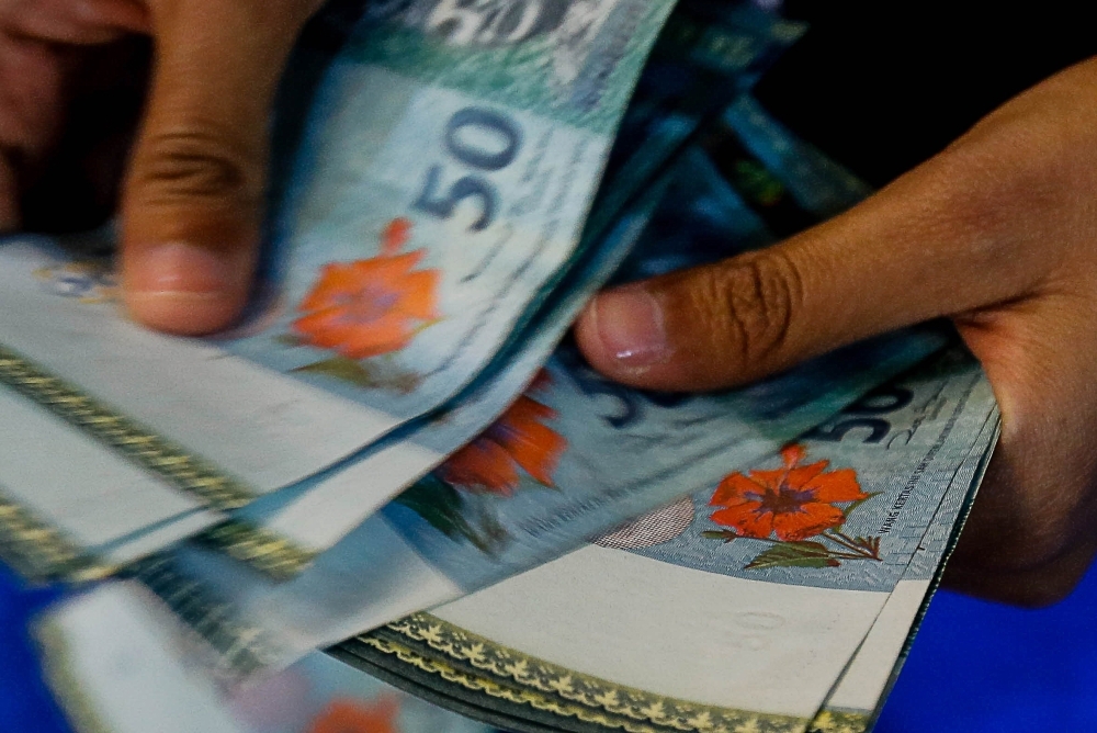 Ringgit slips as markets cheer US court's move against Trump tariffs, delay in Fed cuts