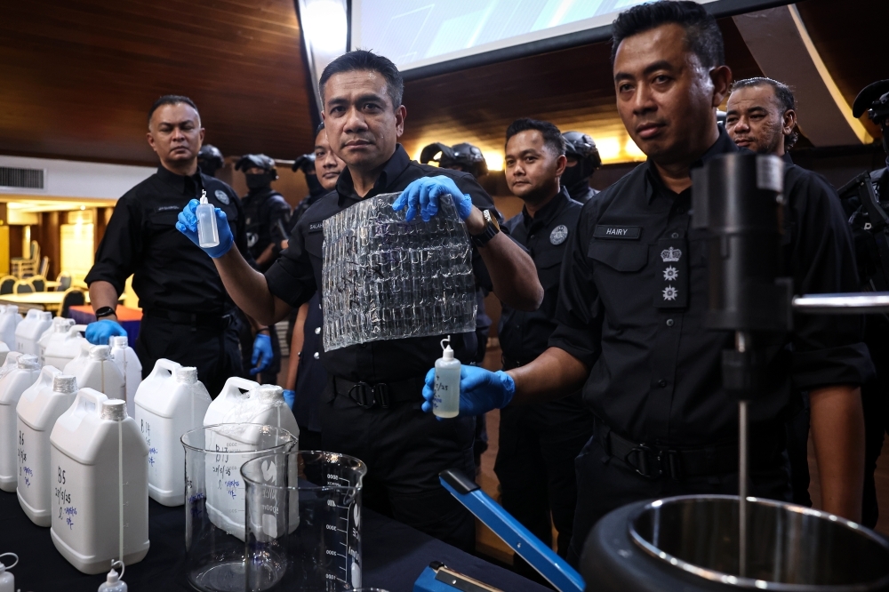 Taiwanese chemists arrested in Brickfields condo drug lab raid, RM3.29m amphetamine vape liquid seized