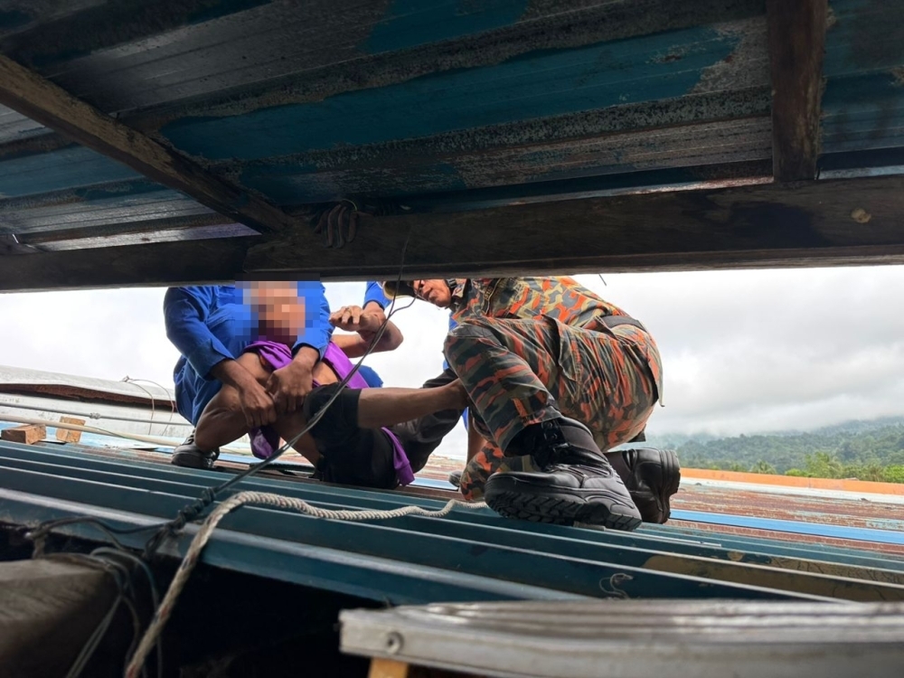Morning drama in Sarawak town as 55-year-old climbs hotel roof, rescued unharmed