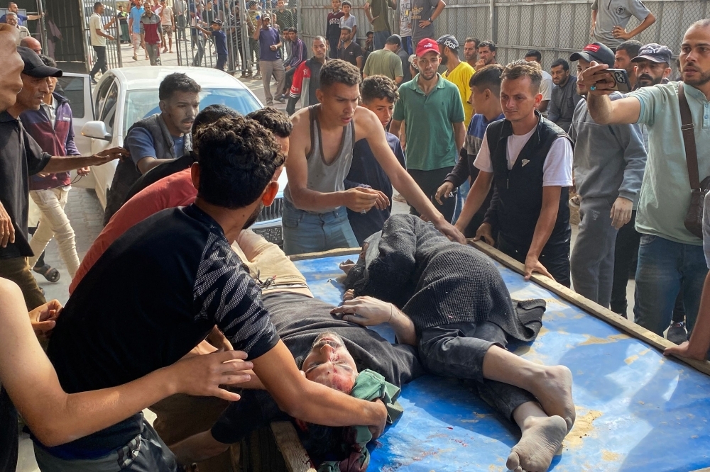 Israeli forces open fire on Gaza crowd at aid site, killing at least 27 Palestinians
