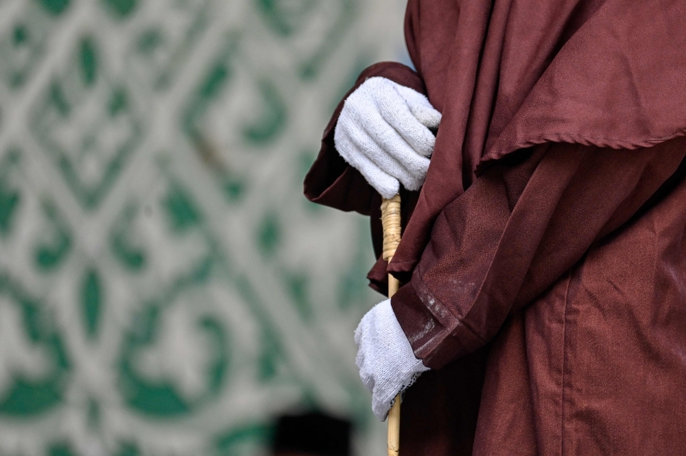 Unmarried couple flogged 100 times in Indonesia's Aceh for sex outside marriage under strict Shariah law