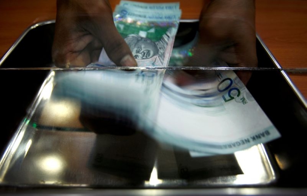 Ringgit eases slightly against US dollar on stronger American job data