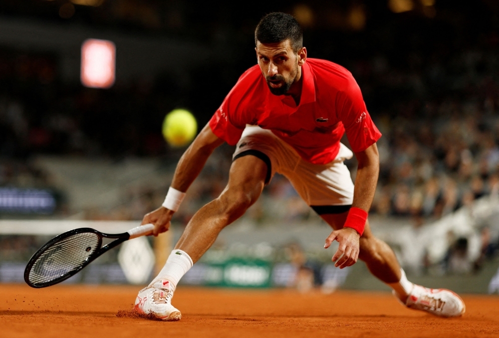 Djokovic turns to drop shot magic in testing French Open win