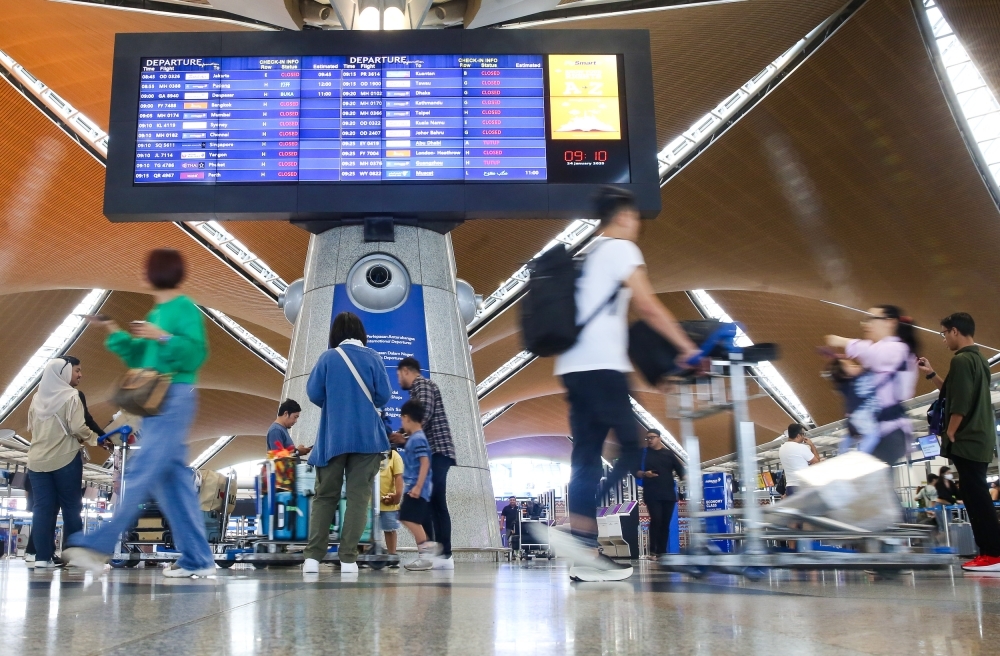 Bukit Aman nabs two over KLIA Haj scam, denies detaining stranded pilgrims