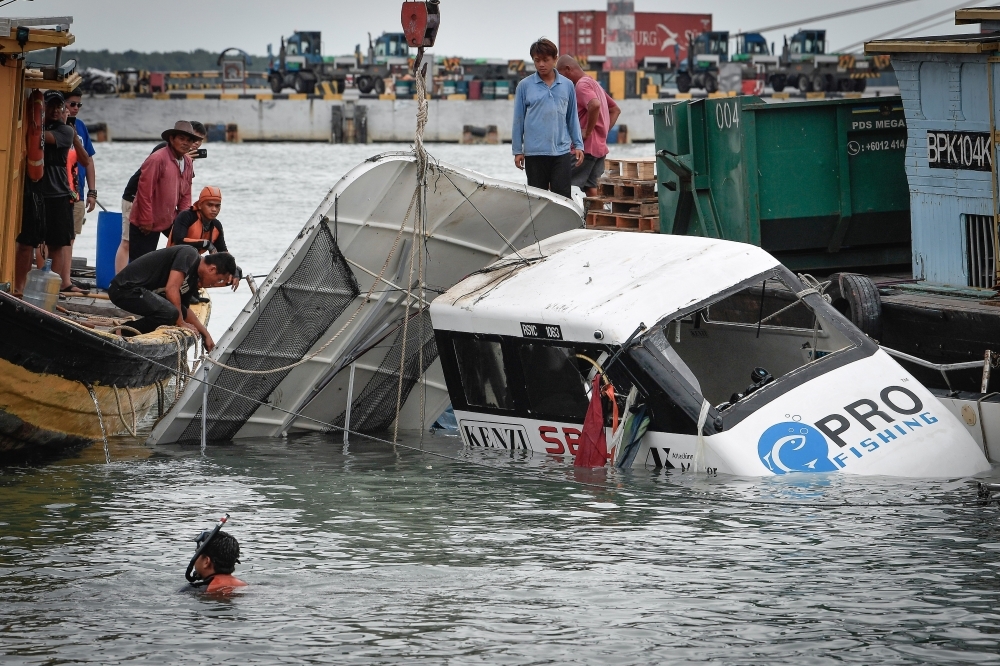 Mother's grief unbearable as she identifies son lost in Tanjung Harapan boat tragedy