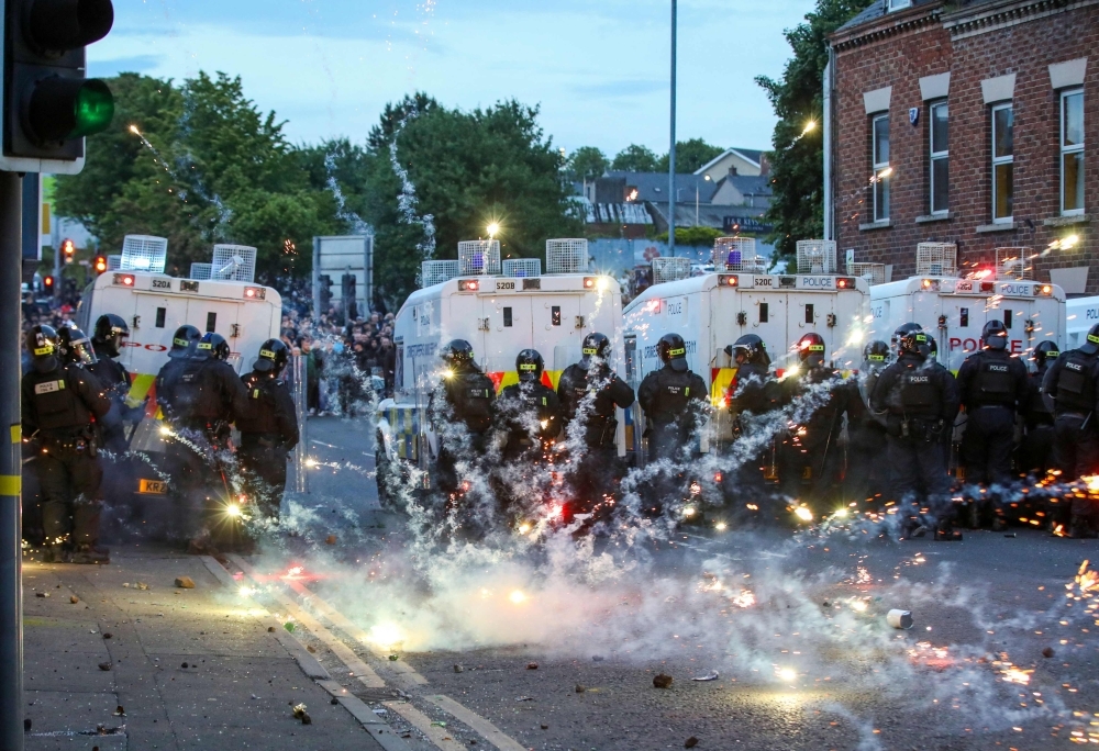 Third night of anti-immigrant violence hits Northern Ireland town as police face petrol bombs and protest