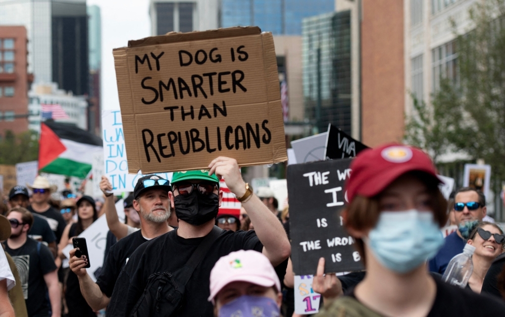 No kings, just quips: Protesters roast Trump with cardboard sass