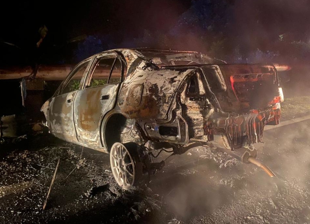 Driver survives fiery crash in Gua Musang after car skids, slams into barrier and bursts into flames