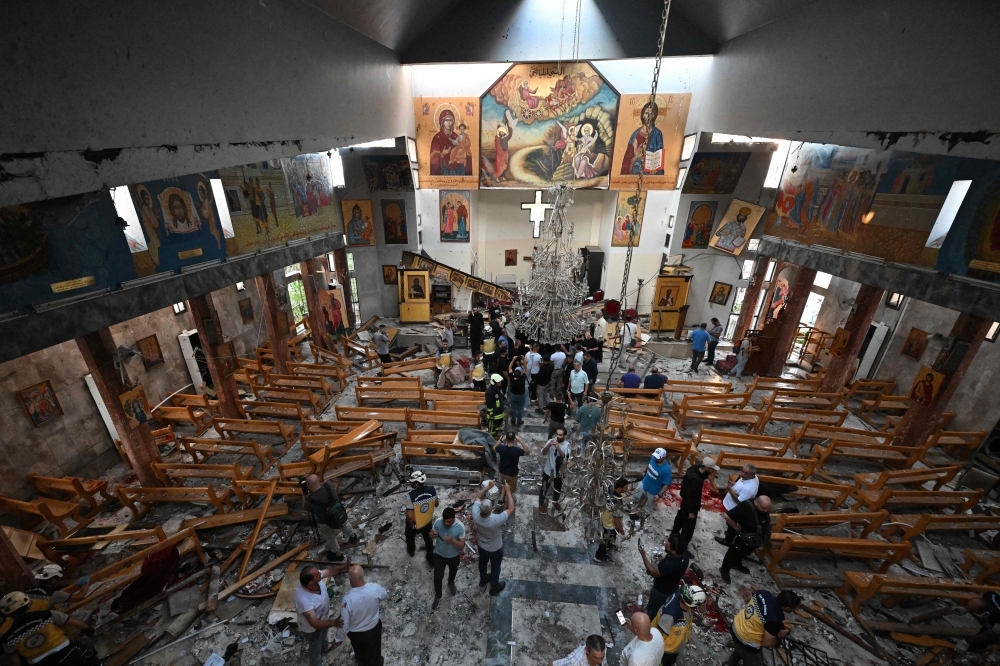 Suicide bomber kills 22 in Damascus church attack; IS blamed in Syria's first such strike since war began