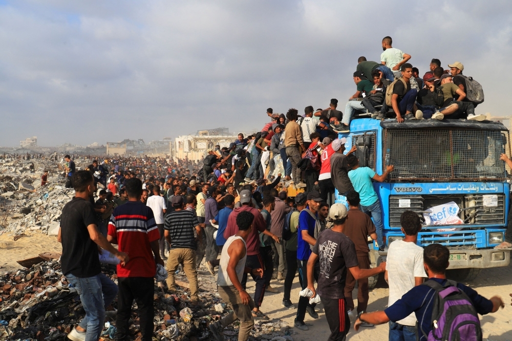 Gaza rescuers say Israeli forces gunned down 21 Palestinians waiting for aid