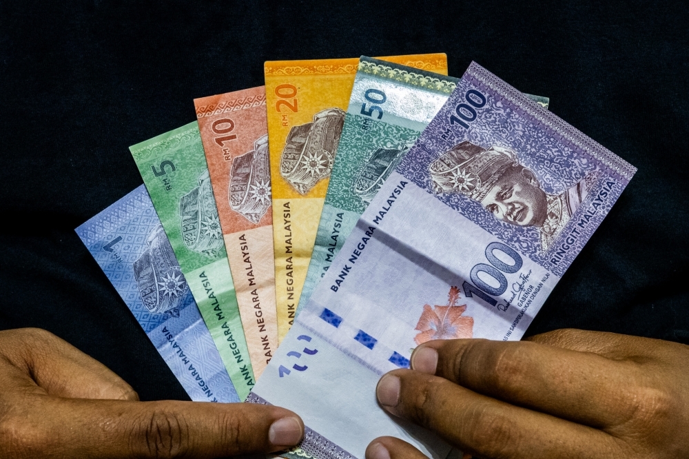Ringgit inches up on US dollar weakness, slips against other majors
