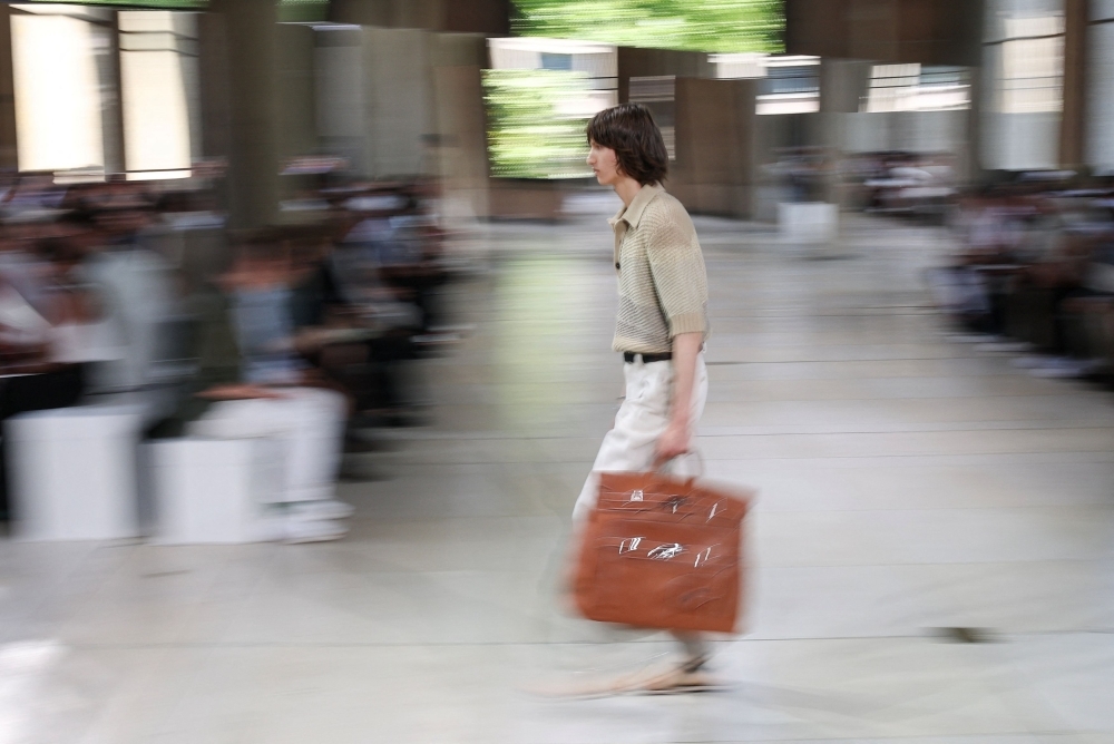 Hermes shows woven leather tops and trousers for men on Paris runway