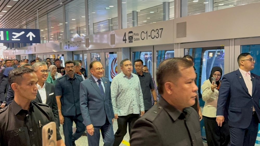 Anwar rides upgraded KLIA Aerotrain, says it's ‘good, faster than before'