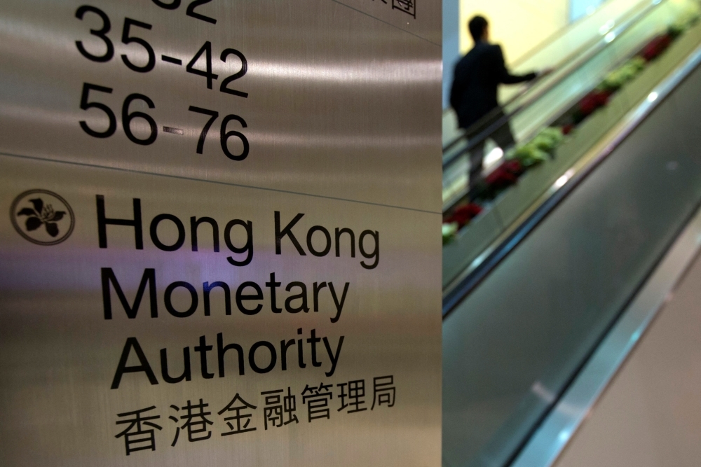 Hong Kong's de facto central bank steps in as currency hits weak end of trading band