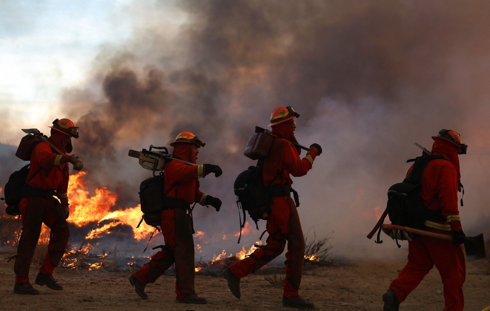 California's biggest fire this year forces evacuations as Trump slashes federal disaster response funding