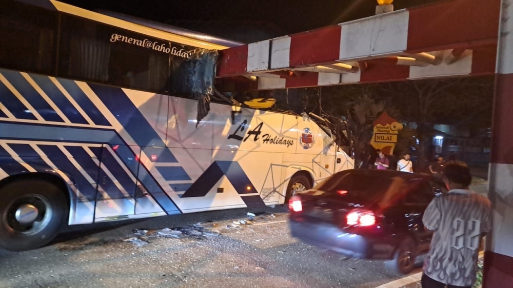 Express bus crashes into height barrier in Nilai, seven passengers suffer minor injuries