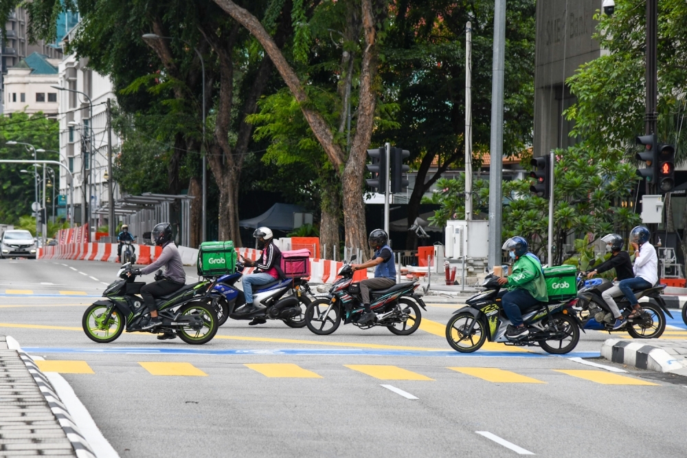 Singapore govt, NTUC and Grab form work group to address illegal foreign delivery riders
