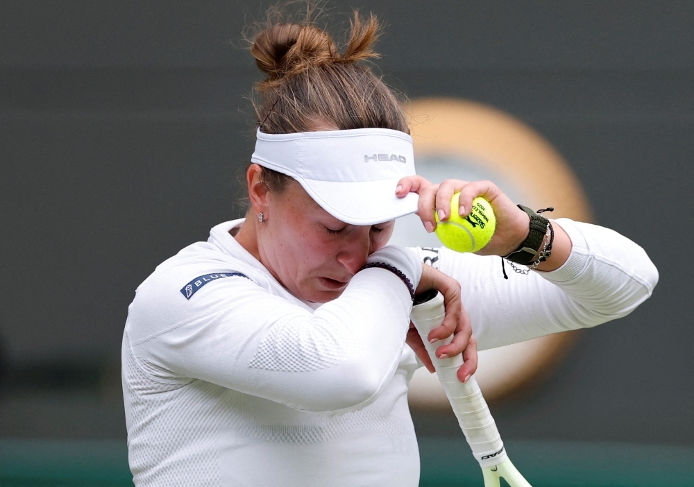 Wimbledon champion Krejcikova crashes out in tears, Djokovic reaches century