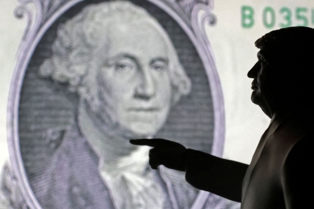Greenback stumbles to multi-year lows ahead of Trump's trade D-Day