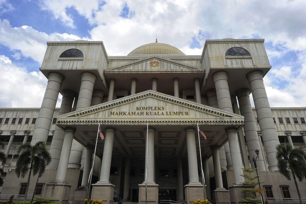 Anwar, govt cleared as court strikes their names from Mukhriz Mahathir's RM5m tax challenge