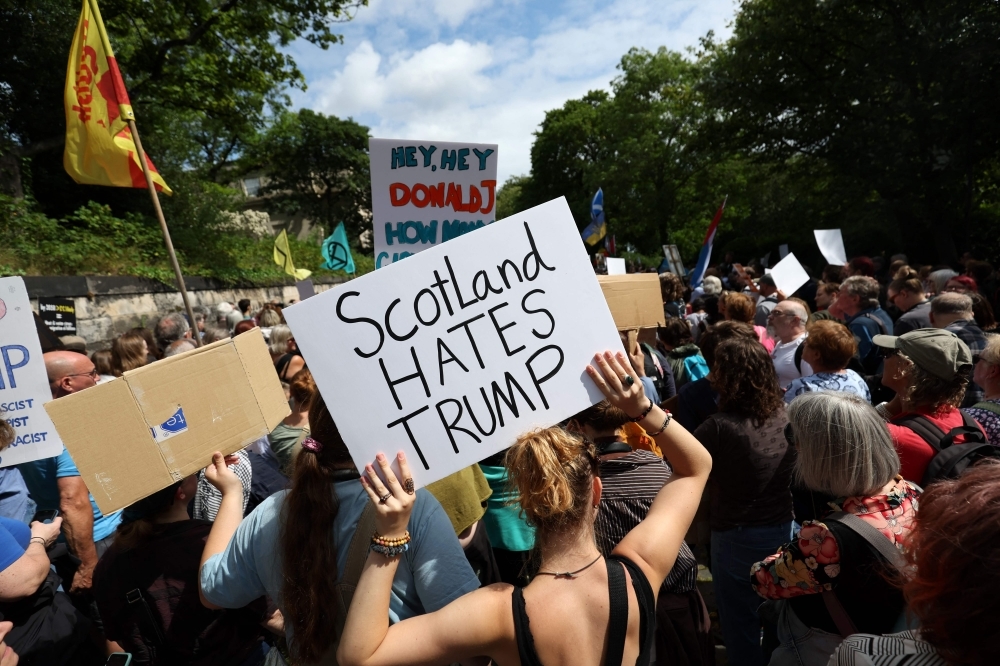 Trump plays golf under tight security in Scotland as protests erupt over visit