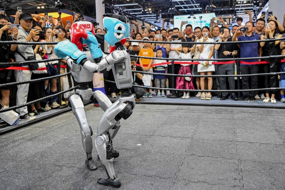 China's AI flexes at WAIC with beer-serving bots and digital avatars