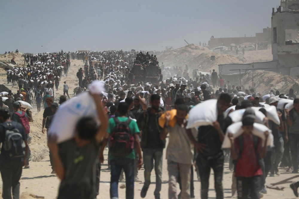 UN races to reach Gaza's starving as Israel allows limited pause, secure aid routes