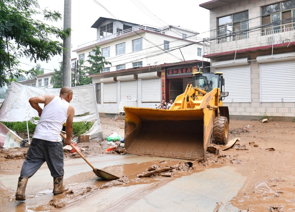 China floods: Over 4,400 evacuated as heavy rains pound Beijing, northern provinces