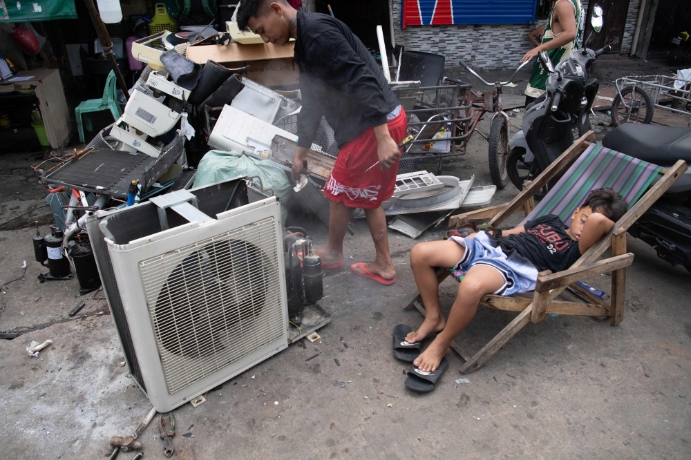 'Food on table' outweighs health risks for Philippine e-waste dismantlers