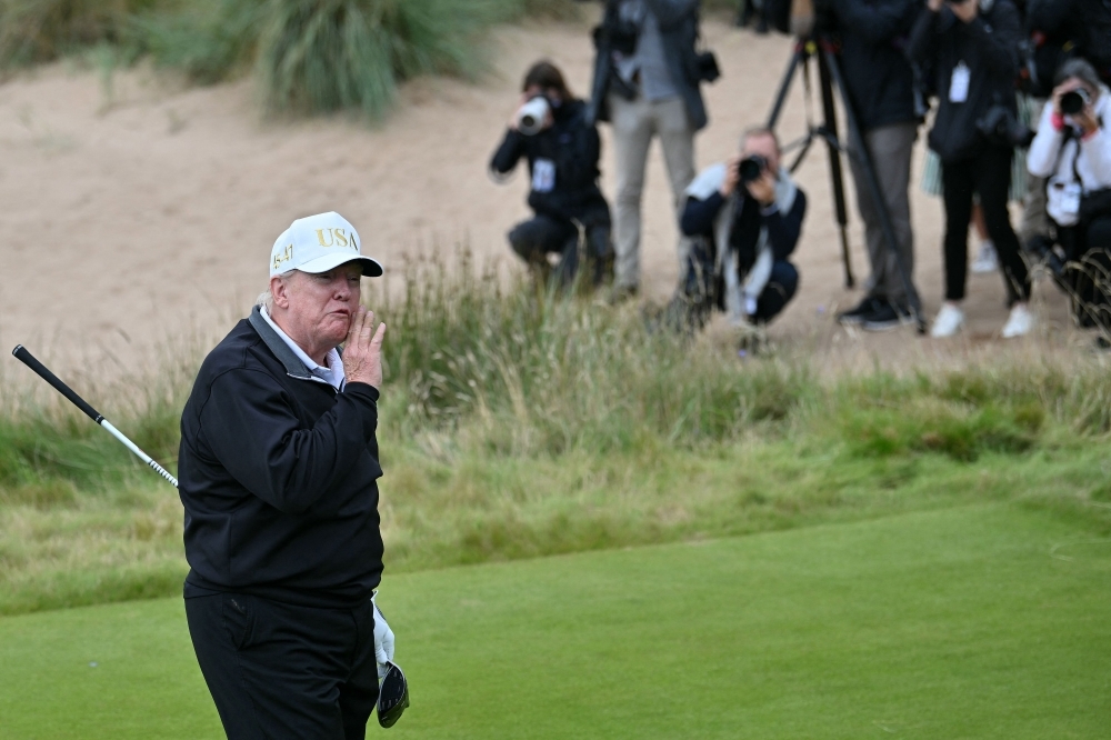 Trump opens Scottish golf course and vows ‘peaceful world'