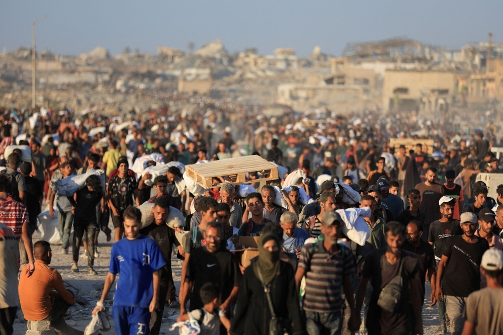 Gaza civil defence: Dozens killed as Israeli troops fire on hungry crowd