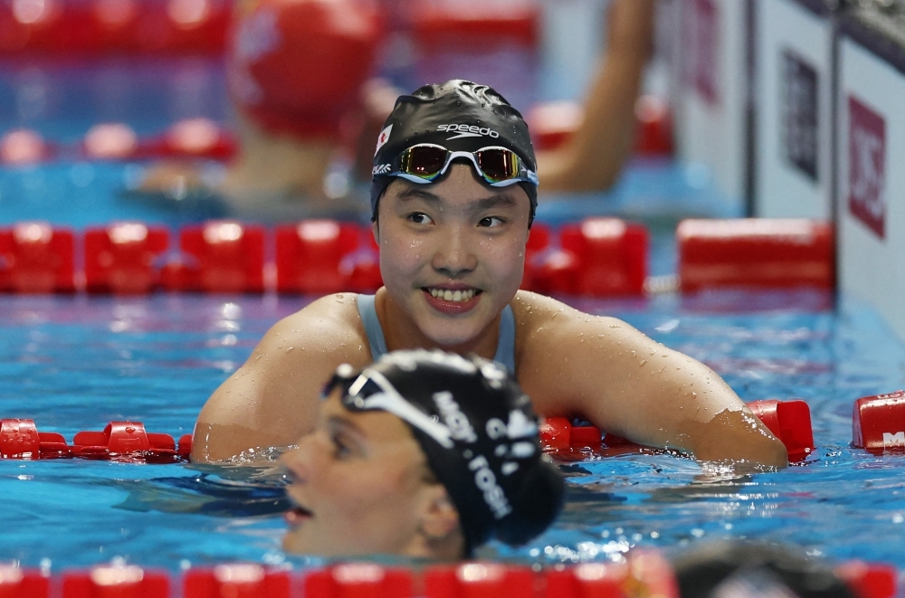 She's 12 and nearly won a world medal, now swimming's age rules under review